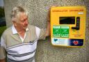 CPD Llanerchymedd FC chairman Elwyn Hughes with the defibrillator. Photo: CPD Llanerchymedd FC / Facebook