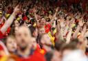 Wales fans celebrate in the stands during March's play-off victory over Austria. Picture: Huw Evans Agency