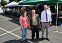 Councillor Nicola Roberts, Emyr Owen of Tatws Trading, and Sion Hughes from the County Council’s Public Protection team.