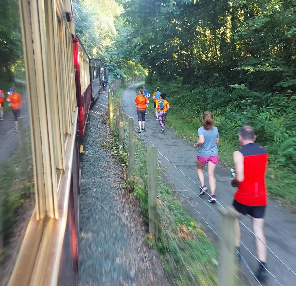 A passengers view as runners Race the Train.