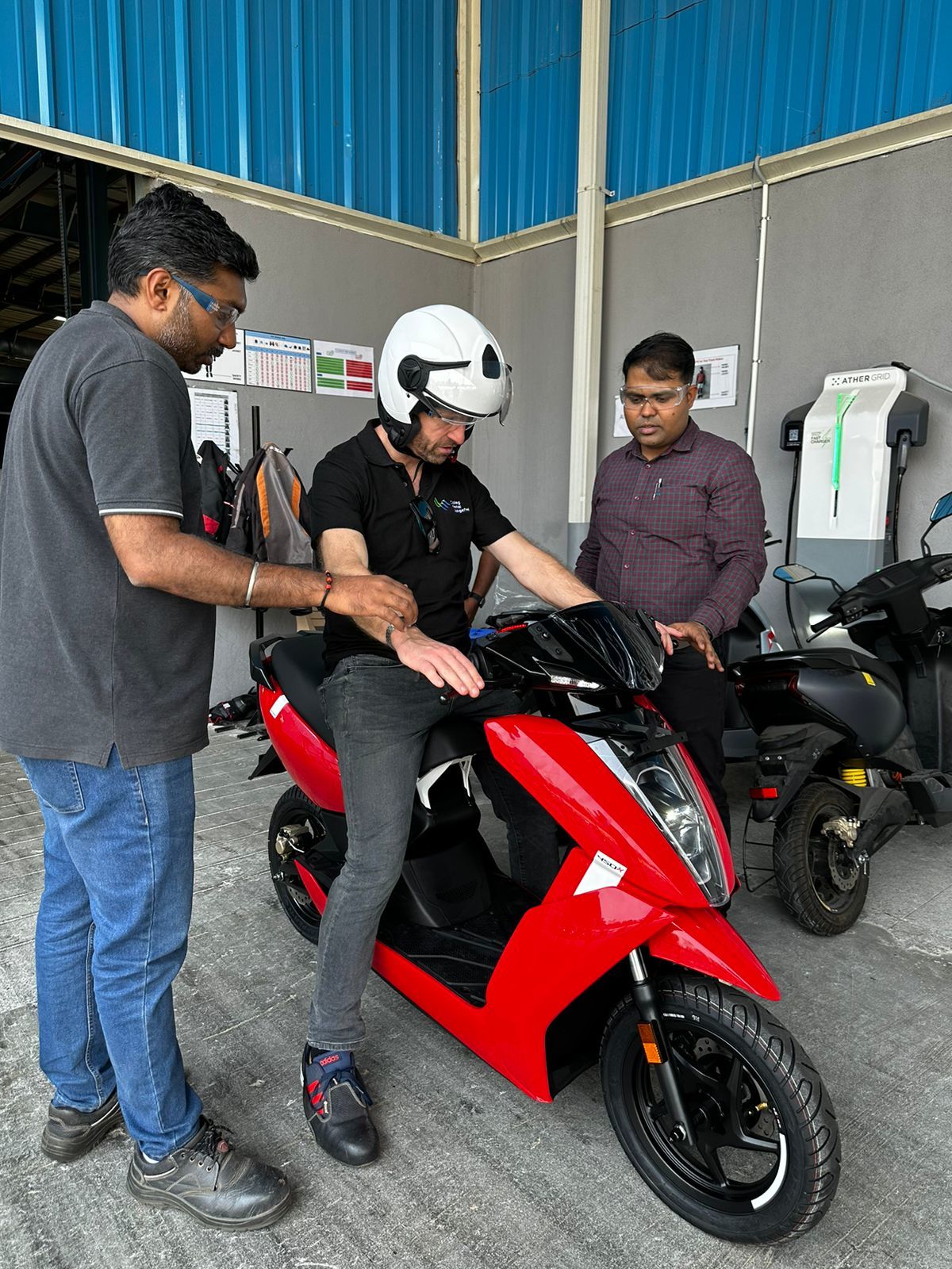 Coleg Llandrillo lecturer Paul Griffith and NPTC lecturer Will Davies tries an electric bike during the trip to India