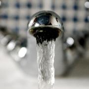 EMBARGOED TO 0001 WEDNESDAY MAY 26 File photo dated 31/01/12 of water running from a household tap. A single social tariff to help the 1.5 million people in England and Wales who are currently living in water poverty would end the 