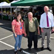Councillor Nicola Roberts, Emyr Owen of Tatws Trading, and Sion Hughes from the County Council’s Public Protection team.