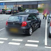 The car left parked on a road in Aldi's car park