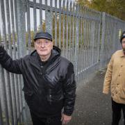 Still locked out...ex-striker Raymond Roberts and his grandson, Dion Wyn, who’s made a documentary to mark the 20th anniversary of the historic Friction Dynamics dispute