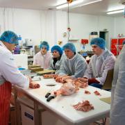Students making ice cream as part of a dairy workshop at the Food Technology Centre in Llangefni