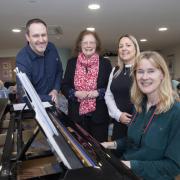 Creative practitioner Emyr Gibson,  Deputy Minister Julie Morgan MS, Bryn Seiont Newydd manager Sandra Evans and musician in residence Nia Davies-Williams.