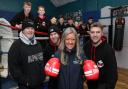 Caren Jones, of Harlech Foodservice who have donated £800 to Caernarfon Boxing Club, pictured with, from left, Ian Owen, head coach, assistant coaches Sion Davies and Delme Davies, and young boxers.