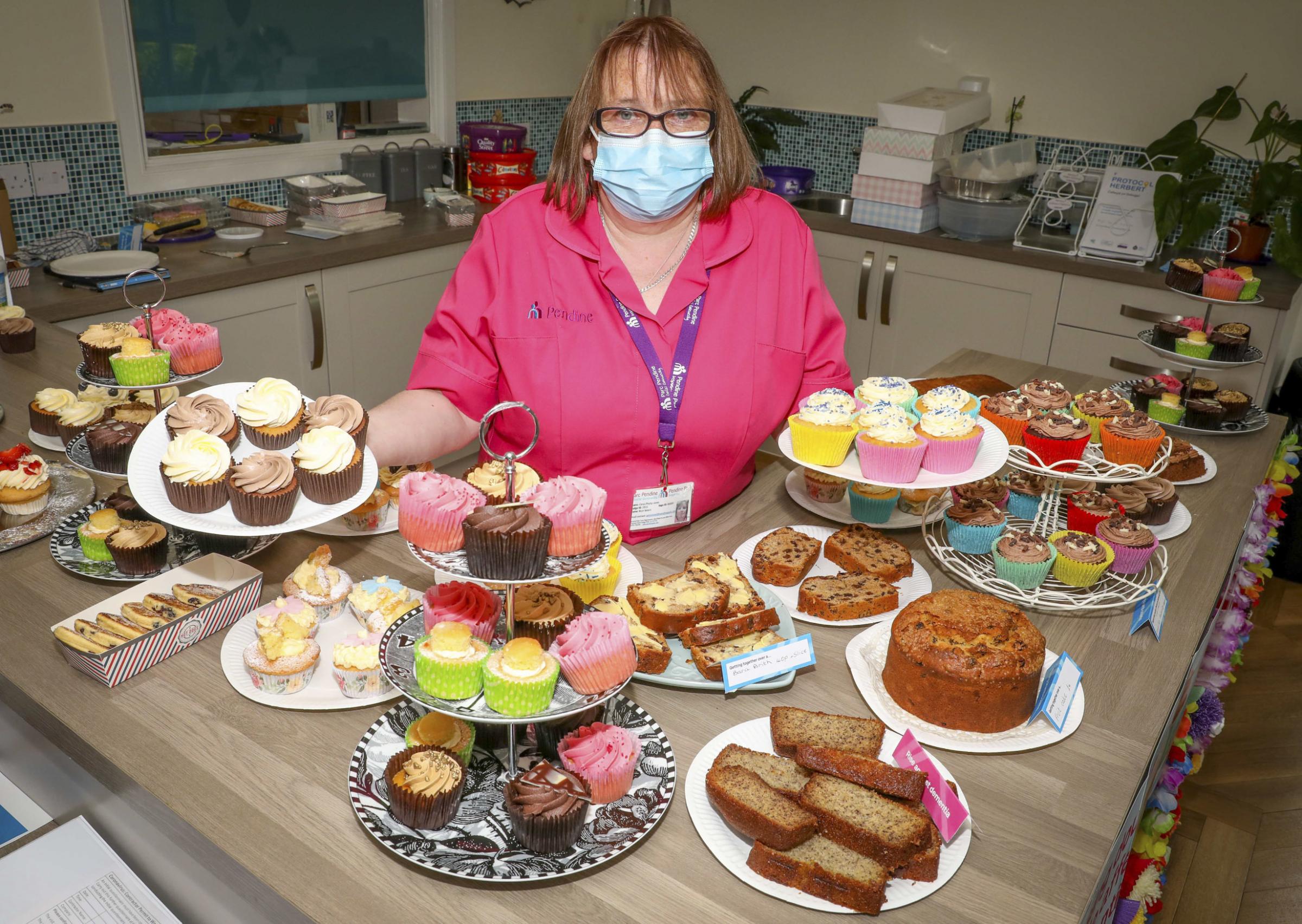 Cerys Philip-Jones shows off some of the fabulous cakes