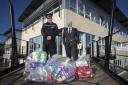 Supt Jon Bowcott, North Wales Police, and Ashley Rogers,  Chair of North Wales Police and Community Trust (PACT) with bagfuls of seized stolen property.