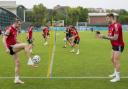 Wales' Gareth Bale, left, controls the ball as he practices with teammate Joe Rodon during a team training session at Rome's Acqua Acetosa training center, Thursday, June 24, 2021. (AP Photo/Andrew Medichini).
