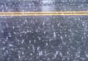 Generic image of a wet road surface.