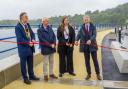 Huw Irranca-Davies cutting the ribbon on the new defences, with Councillor Beca Roberts, Chair of Cyngor Gwynedd; Councillor Medwyn Hughes, former Chair of Gwynedd Council; and Bangor City Mayor, Councillor Gareth Parry.