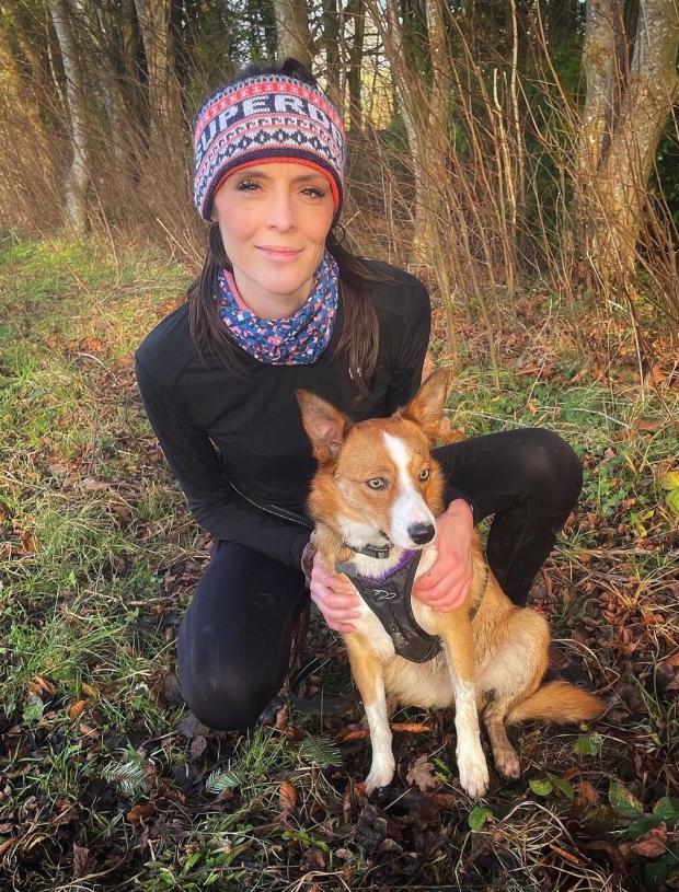 North Wales Chronicle: Charlotte Rose Wilton-Jones with Ottie, who made his debut at the Canicross trail race. Photo: Charlotte Rose Wilton-Jones