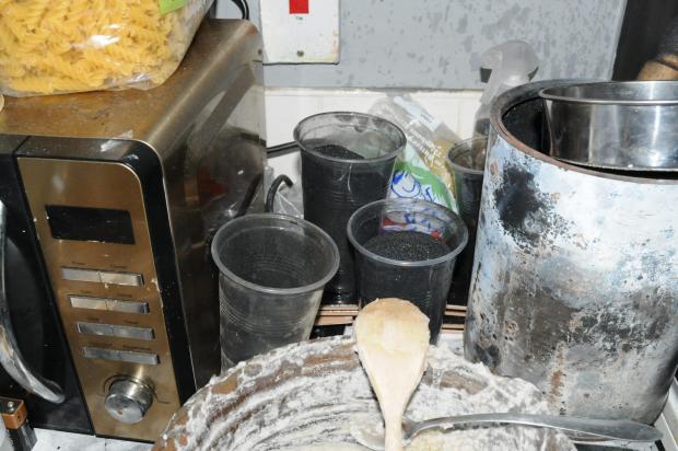 North Wales Chronicle: Undated Counter Terrorism Policing North East handout photo of the kitchen at Hill Top Walk, Keighley, used by members of a “fascist” terror cell who have been found guilty of a range of offences. 