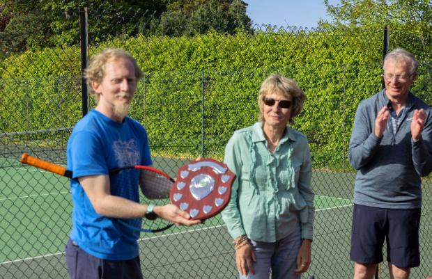 North Wales Chronicle: Bangor Tennis Club captain Kevin Patey is presented with the Shield. Photo: Bangor Tennis Club