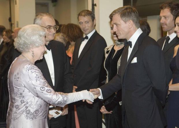 North Wales Chronicle: The Queen and Daniel Craig. PA