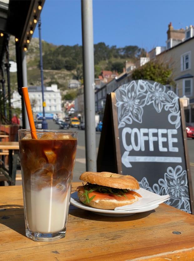 North Wales Chronicle: An iced latte and a bagel from Providero. Photo: Harry Ormerod