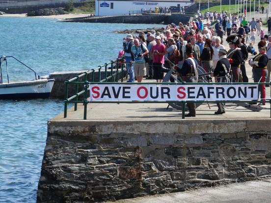 North Wales Chronicle: Campaigners protesting near the beach