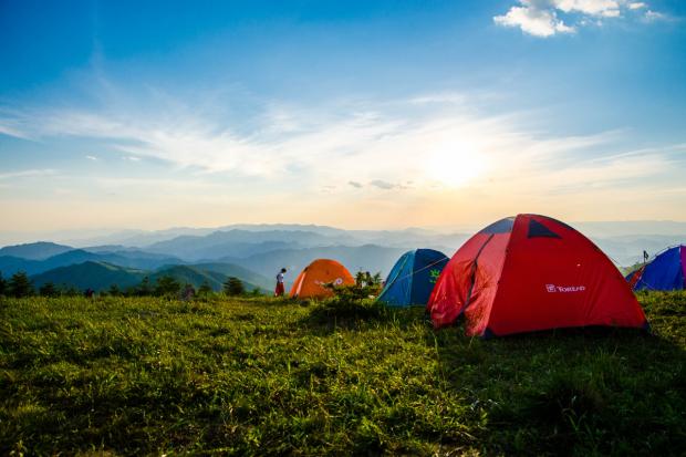 North Wales Chronicle: Tents in the countryside. Credit: Canva