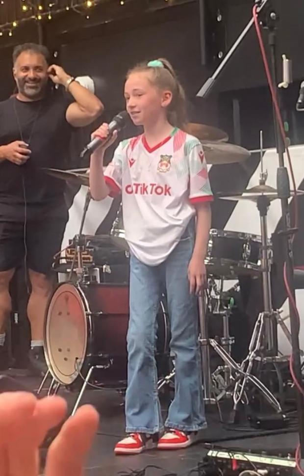 North Wales Chronicle: Madi up on the stage at Wembley Boxpark.