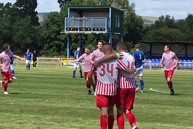 Holywell celebrate one of their goals at Caersws. Picture: HTFC