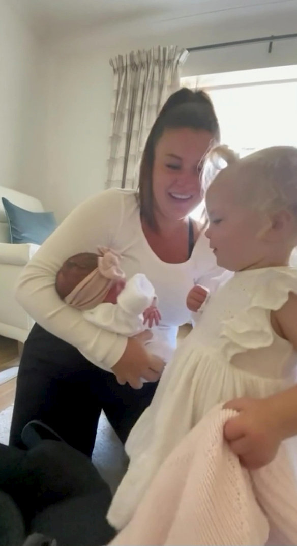 Video grab of the moment 22-month-old Effie Beau Owen met her newborn younger sister, Indie Summer Owen, for the first time. 