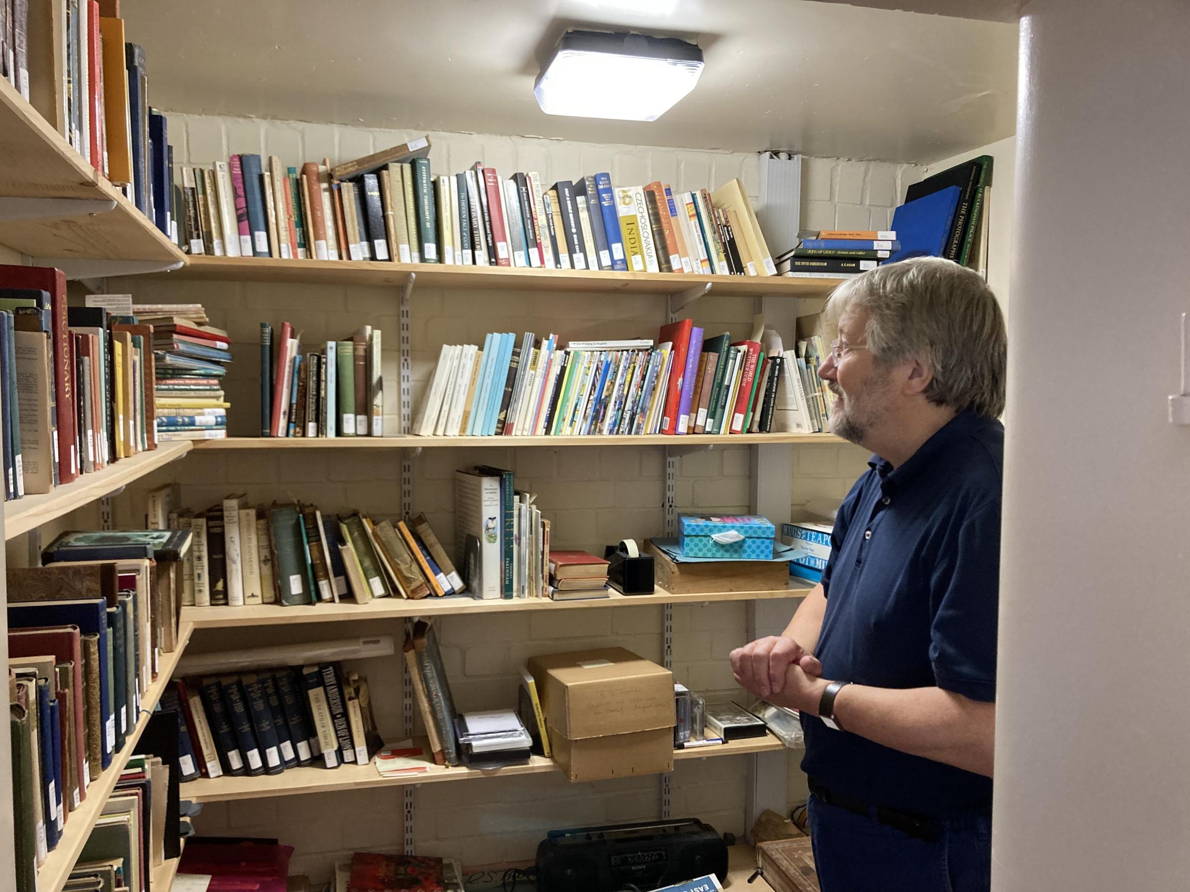 Professor Emeritus Tony Brown looks at the collection of books owned By R.S. Thomas. Picture: Dale Spridgeon