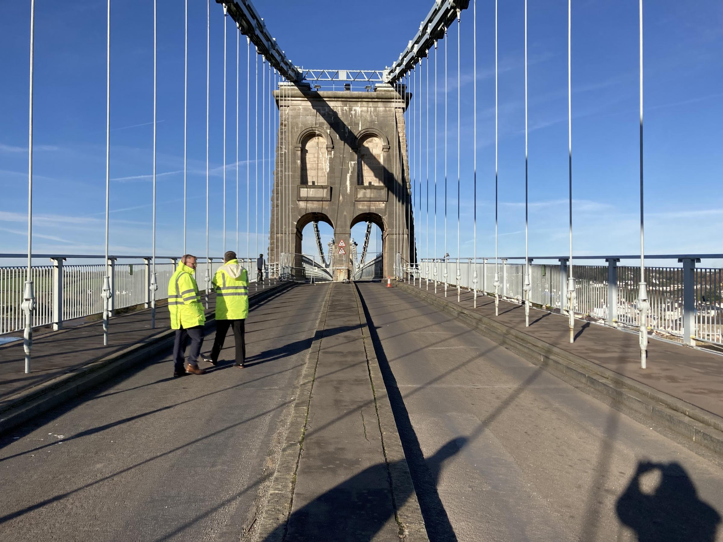 Welsh Government engineers inspect one of the hangers on The Menai Suspension Bridge (Picture Dale Spridgeon LDR)