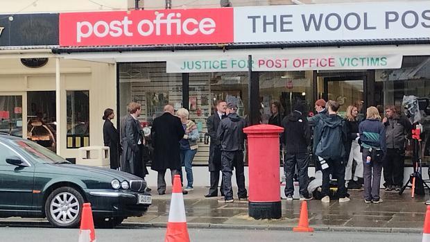 Julie Hesmondhalgh is seen outside the St Davids Hospice. The charity shop has allowed ITV to recreate the post office in their shop. (Image: Glenda Tobin)