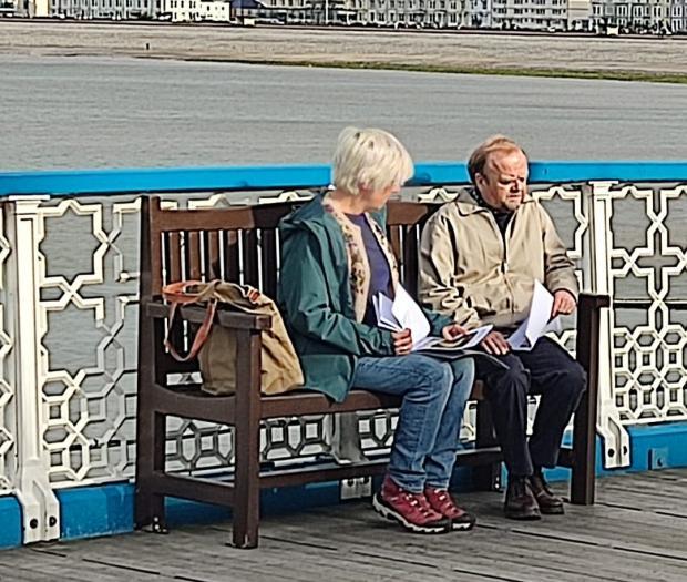 Julie Hesmondhalgh and Toby Jones carry out their scenes on Llandudno Pier (Image: Dee Sturgess)