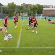 Wales' Gareth Bale, left, controls the ball as he practices with teammate Joe Rodon during a team training session at Rome's Acqua Acetosa training center, Thursday, June 24, 2021. (AP Photo/Andrew Medichini).