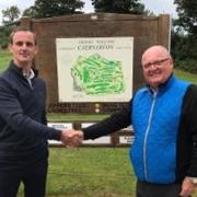Jonathan Kelly (left) with Caernarfon GC chairman, Andre Lambrecht. Photo: Caernarfon Golf Club / Facebook