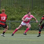 Rob Massam of North Wales Crusaders in action during the game ahead of Edward Mbaraga of London Skolars (8).