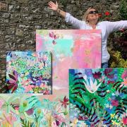 Sharon Harvey with a selection of her paintings