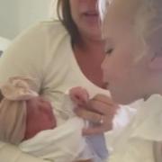 Video grab of the moment 22-month-old Effie Beau Owen met her newborn younger sister, Indie Summer Owen, for the first time ever.