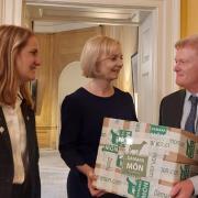 Virginia Crosbie MP and Ynys Môn farmer Peter Williams present a leg of lamb to the Prime Minister at No 10 Downing Street.