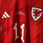 The signed Bale Wales shirt.
