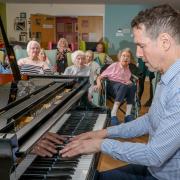 Iwan Llewelyn-Jones playing to the delight of residents
