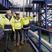 Mark Drakeford, Welsh secretary David Davies, prime minister Rishi Sunak and Stena Line chief operating officer fleet and government affairs Ian Hampton during a visit the Port of Holyhead in Anglesey