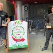 Bike shop staff with their awards.