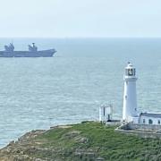 HMS Queen Elizabeth (R08) rounding South Stack lighthouse