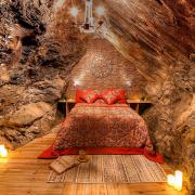 A romantic double bedroom created in a cavern carved out of the slate by miners over a century ago.