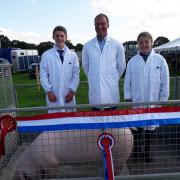 The Roberts family with the champion pig.