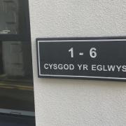 The name plate for Cysgod yr Eglwys