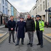 North Wales Deputy Police and Crime Commissioner Wayne Jones, Tref Cybi Councillor Jeff Evans, North Wales Police and Crime Commissioner Andy Dunbobbin and North Wales Police Holyhead Town Sergeant Iwan Jones, photographed on Market Street In Holyhead
