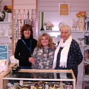 Tenovus shop volunteers, Sandra Williams with volunteers Monica Jones, and Jude.