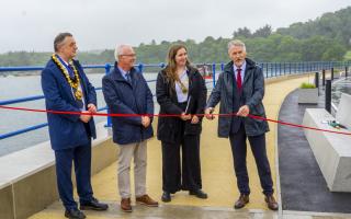 Huw Irranca-Davies cutting the ribbon on the new defences, with Councillor Beca Roberts, Chair of Cyngor Gwynedd; Councillor Medwyn Hughes, former Chair of Gwynedd Council; and Bangor City Mayor, Councillor Gareth Parry.